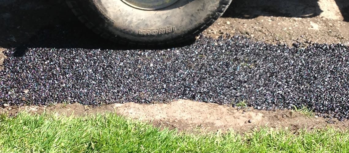 Applying EZ Street Asphalt on golf course path