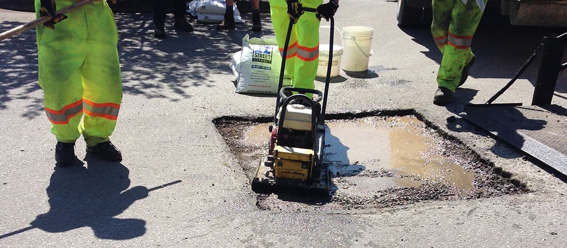 BOMAG plate compactor on EZ Street repair
